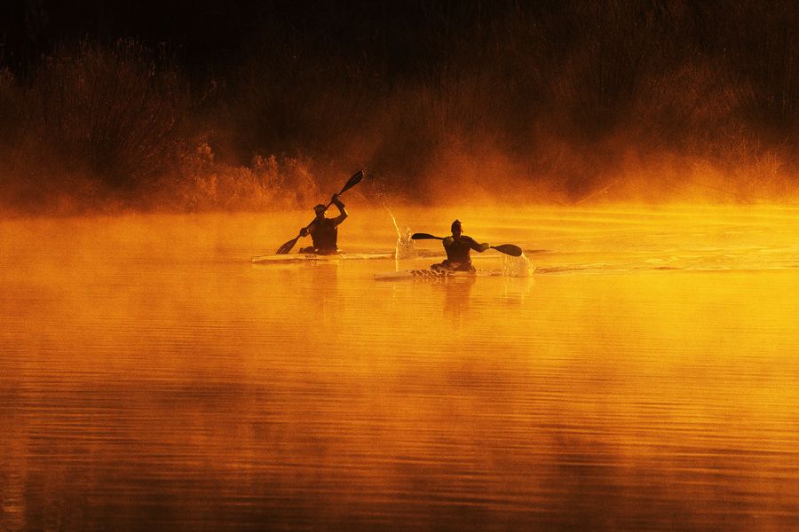 Kayakers at sunrise